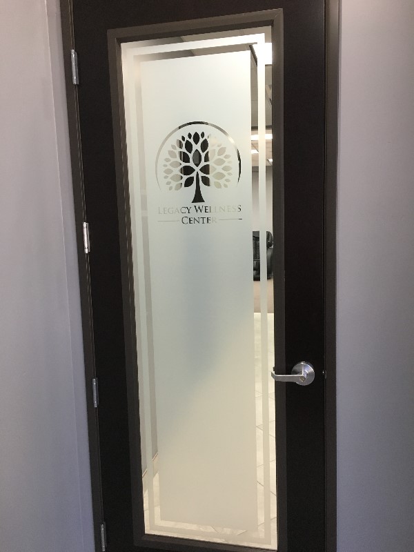 Legacy Wellness Center branded glass door